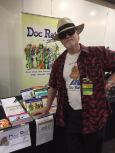 Jenner selling Doc Rat merchandise at ConFurgence 2017, Melbourne, Australia.